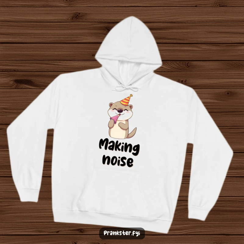Funny hoodie showcasing a cheerful otter in a party hat, energetically blowing a noise maker, embodying pure celebration and cozy fun.
