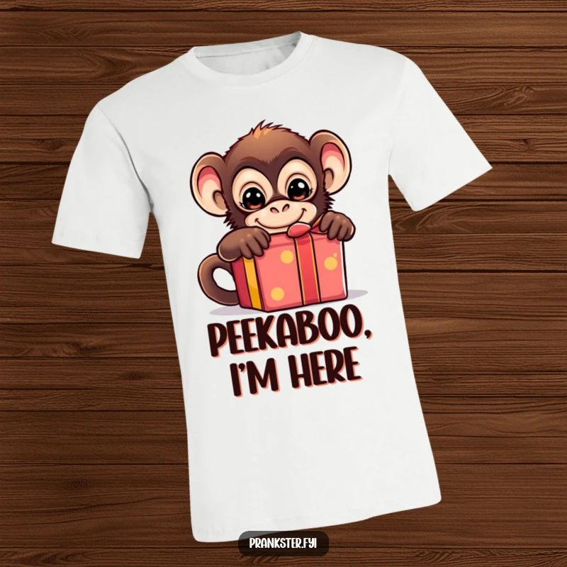Funny T-shirt with a mischievous monkey peeking from behind a colorful gift box, exuding playful energy.